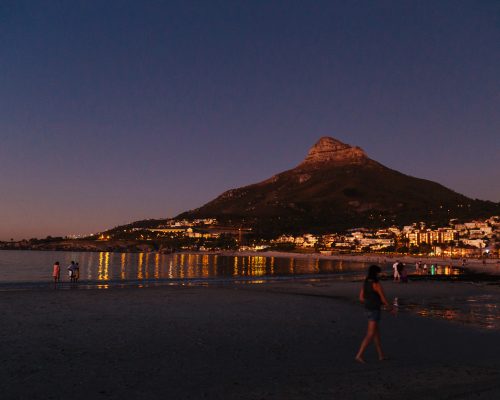 A view of Camps Bay and Lions Head at night